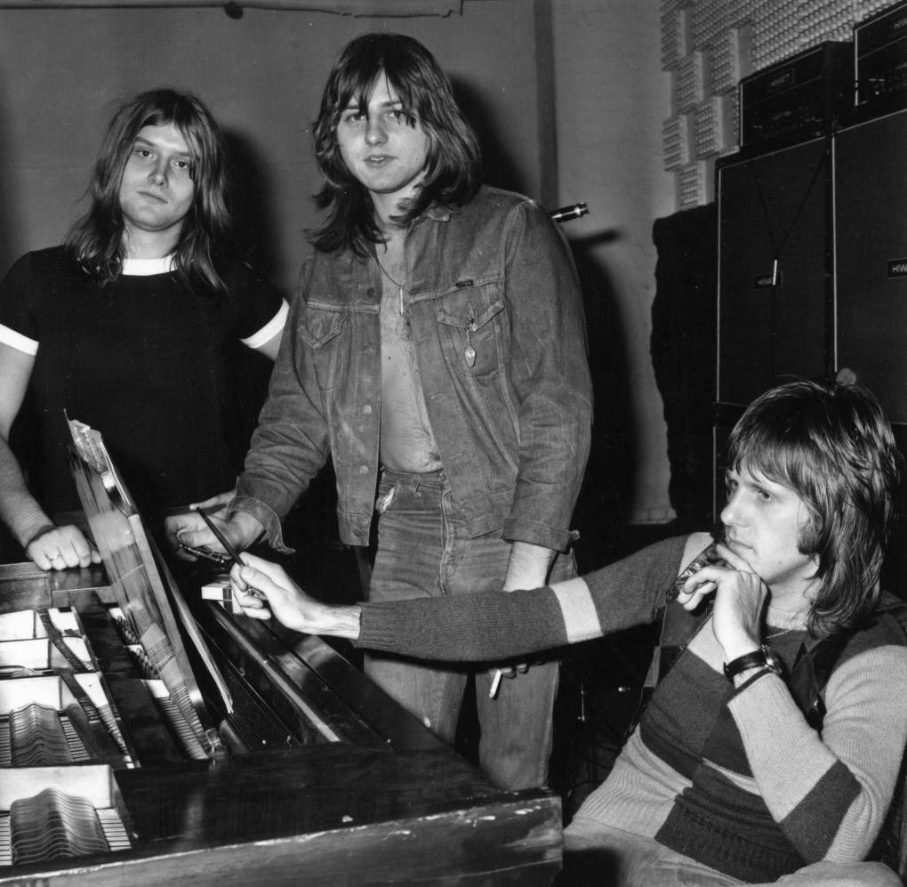 18th November 1971:  Progressive rock group ELP, or Emerson, Lake and Palmer, in the studio for the recording of their album, 'Trilogy'. From left to right: Carl Palmer (drums), Greg Lake (vocals, bass, guitar) and Keith Emerson (keyboards).  (Photo by Norman Quicke/Express/Getty Images)